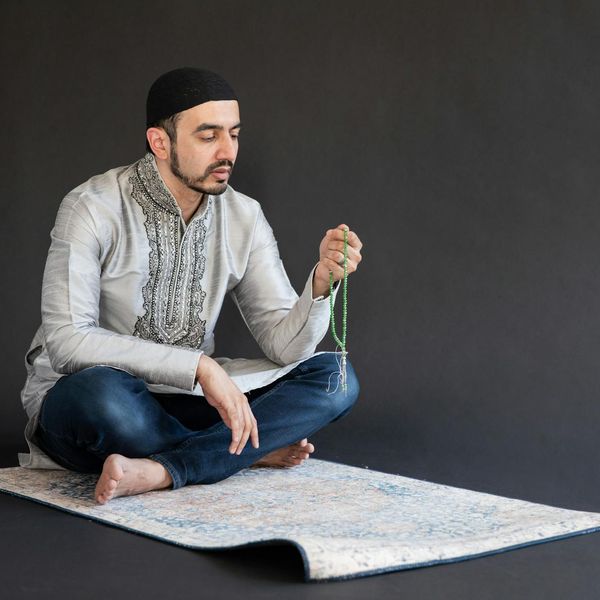 Person practicing meditation in a peaceful studio environment